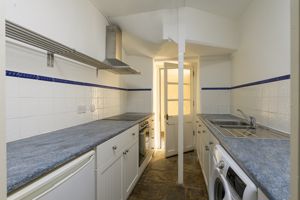 Kitchen with door to rear courtyard- click for photo gallery